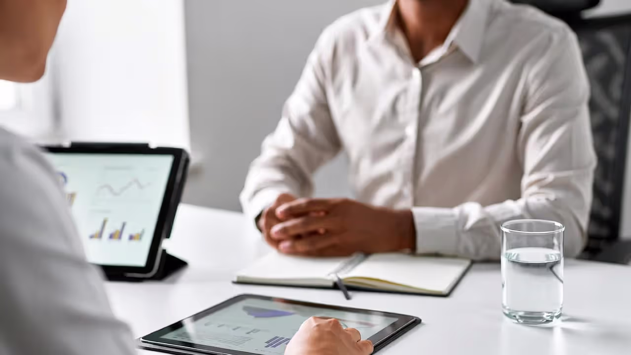 Adult consulting a registered dietitian about intermittent fasting in a modern clinic office